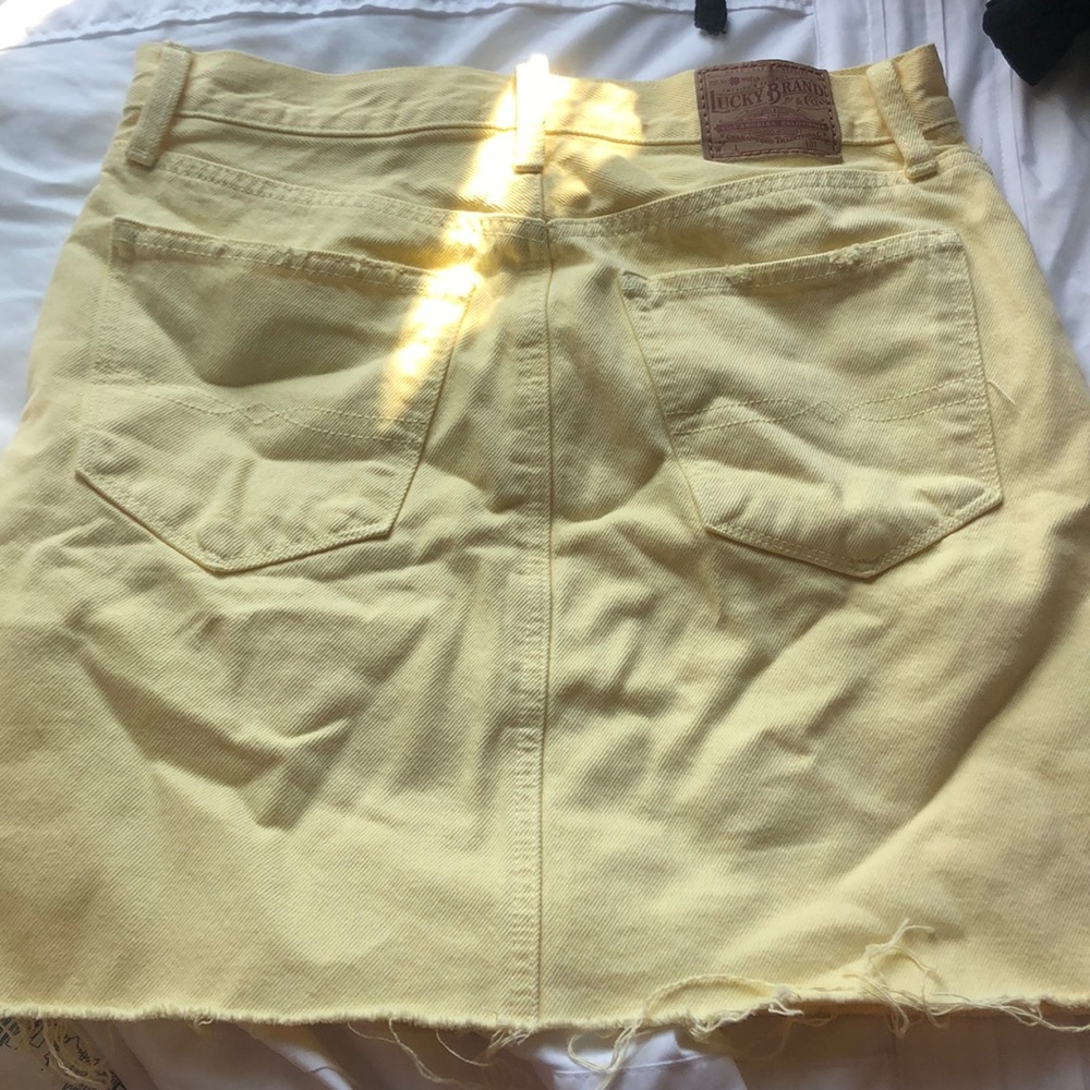 Never worn light yellow jean skirt